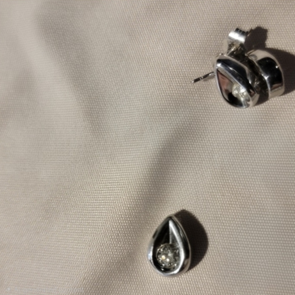 Diamond teardrop pendant and stud earrings